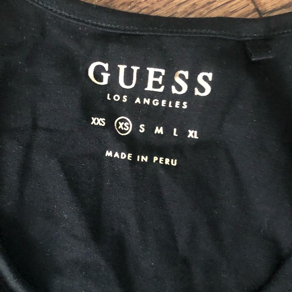 Guess Black Tank Top Showing a Beautiful Woman Wearing Coper Aviator Sunglasses - Picture 4 of 4